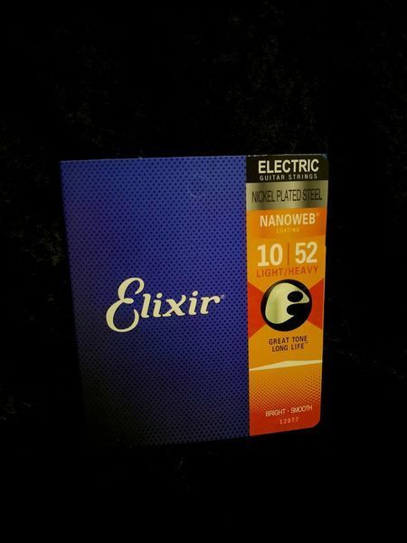 Струни для електрогітари Elixir EL NW LH Nickel Plated Light-Heavy 10-52 236043 фото